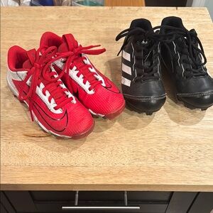 Two pairs of Boys size 12 Cleats  football and baseball